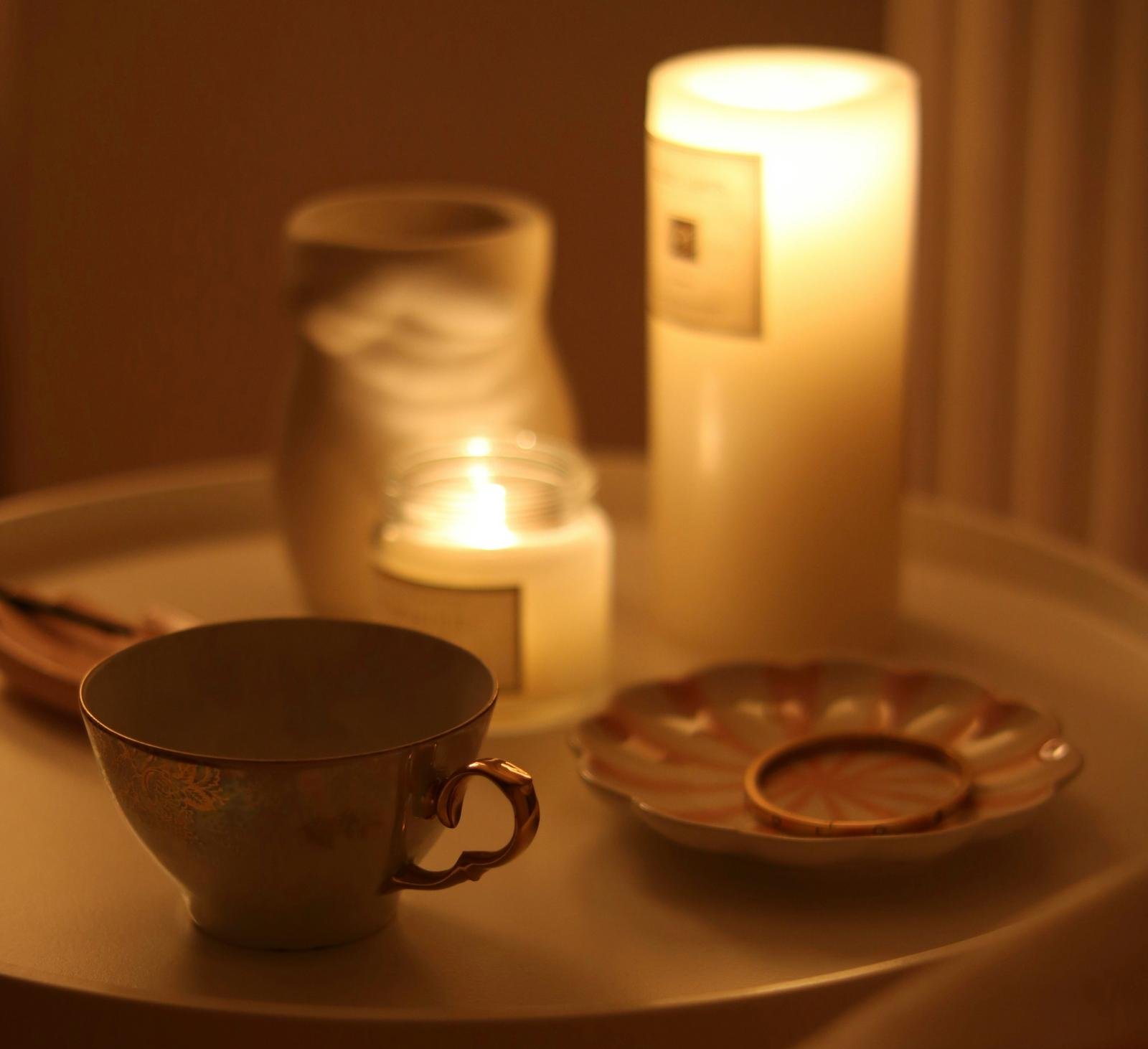 Cozy self-care ritual with tea and candles