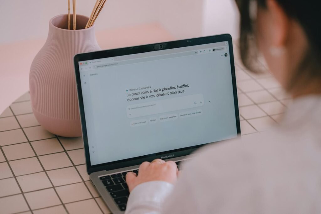 Woman writing at a computer while working