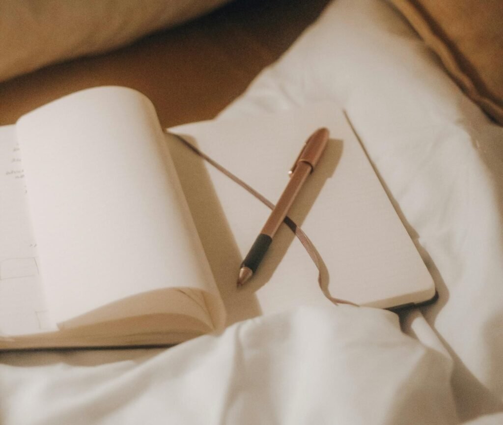 Open journal with a pen for mindful reflection