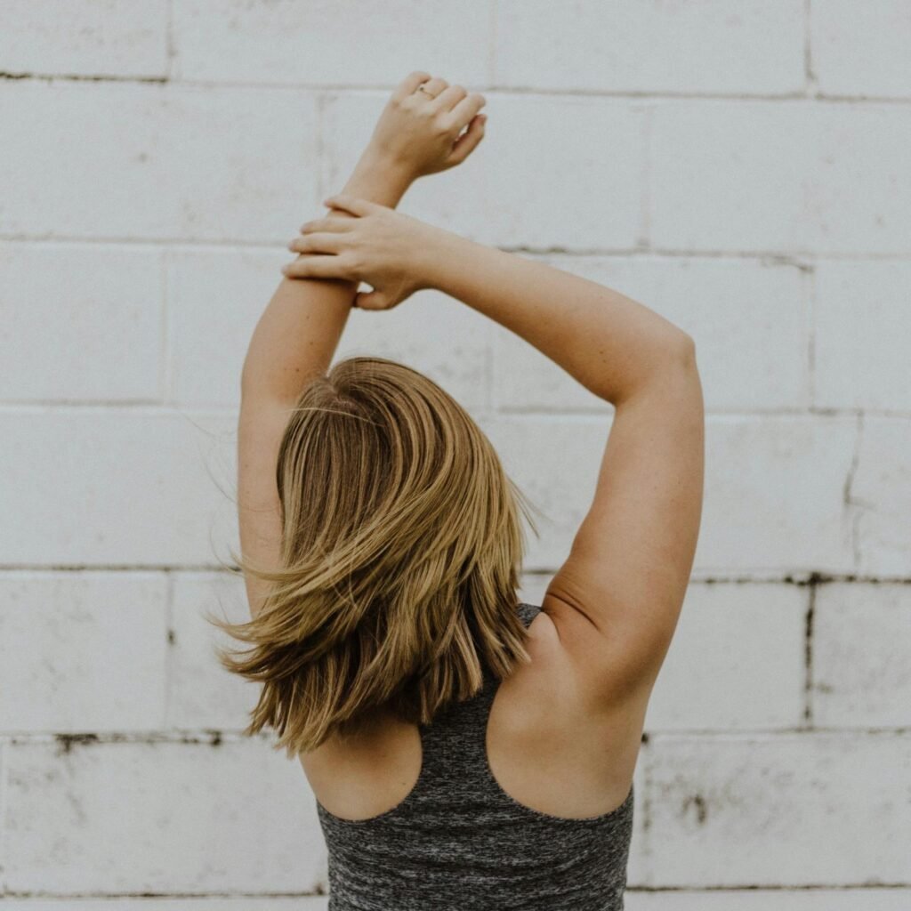 Woman stretching her back and shoulders