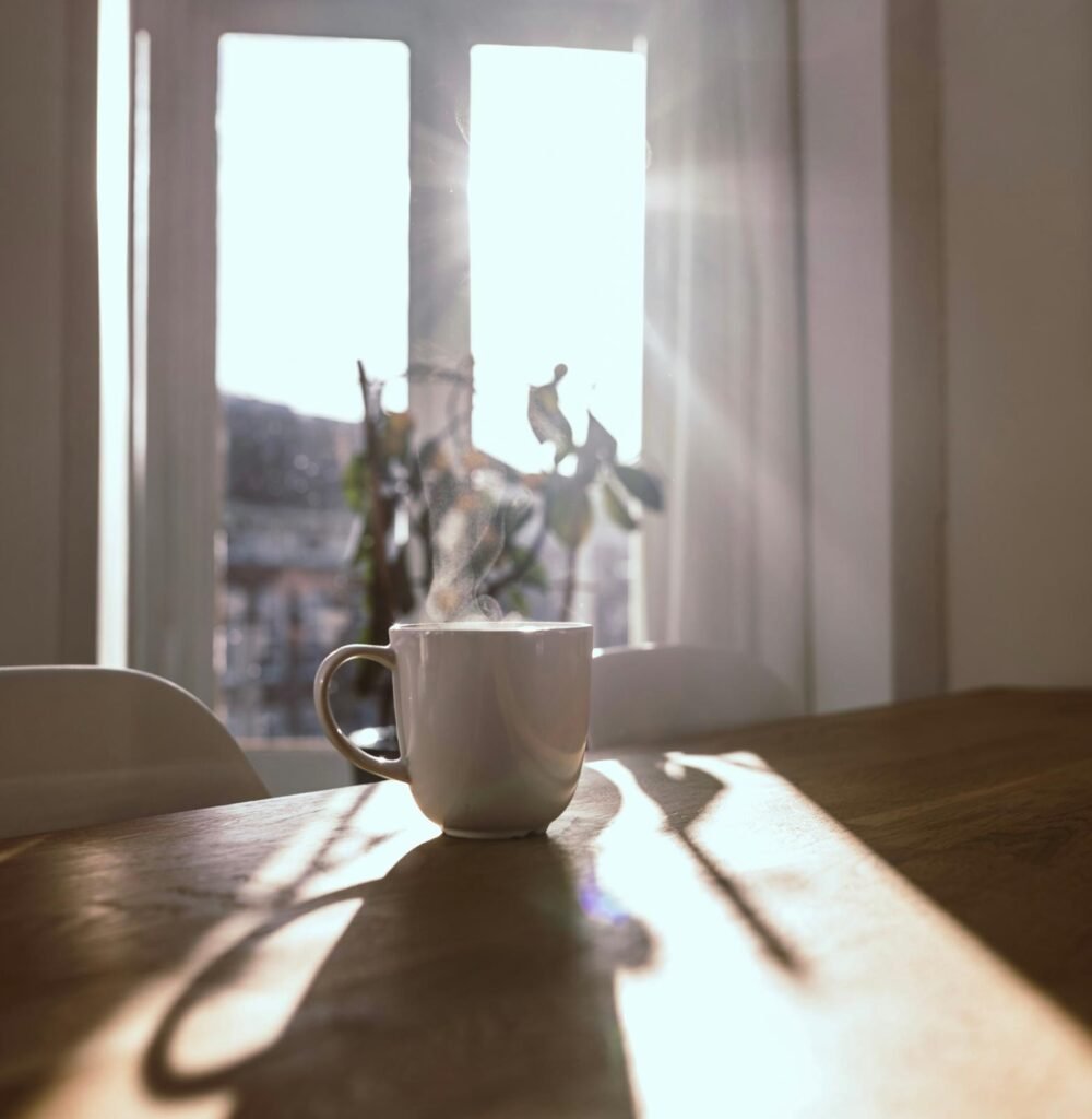 Cup on a table illuminated by soft natural light from a window